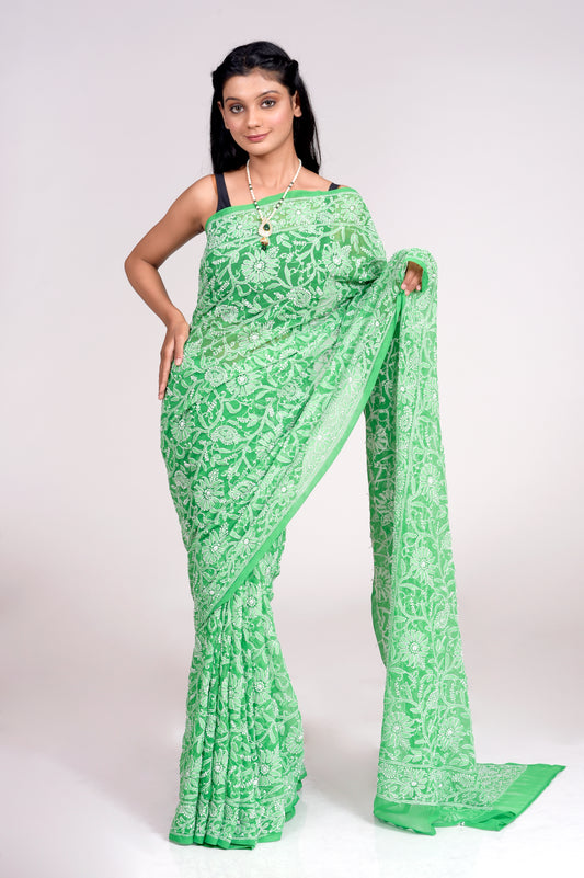 Lucknow Chikan Emporium Semi Georgette Green Colour Saree With Same Colour Blouse piece included. .