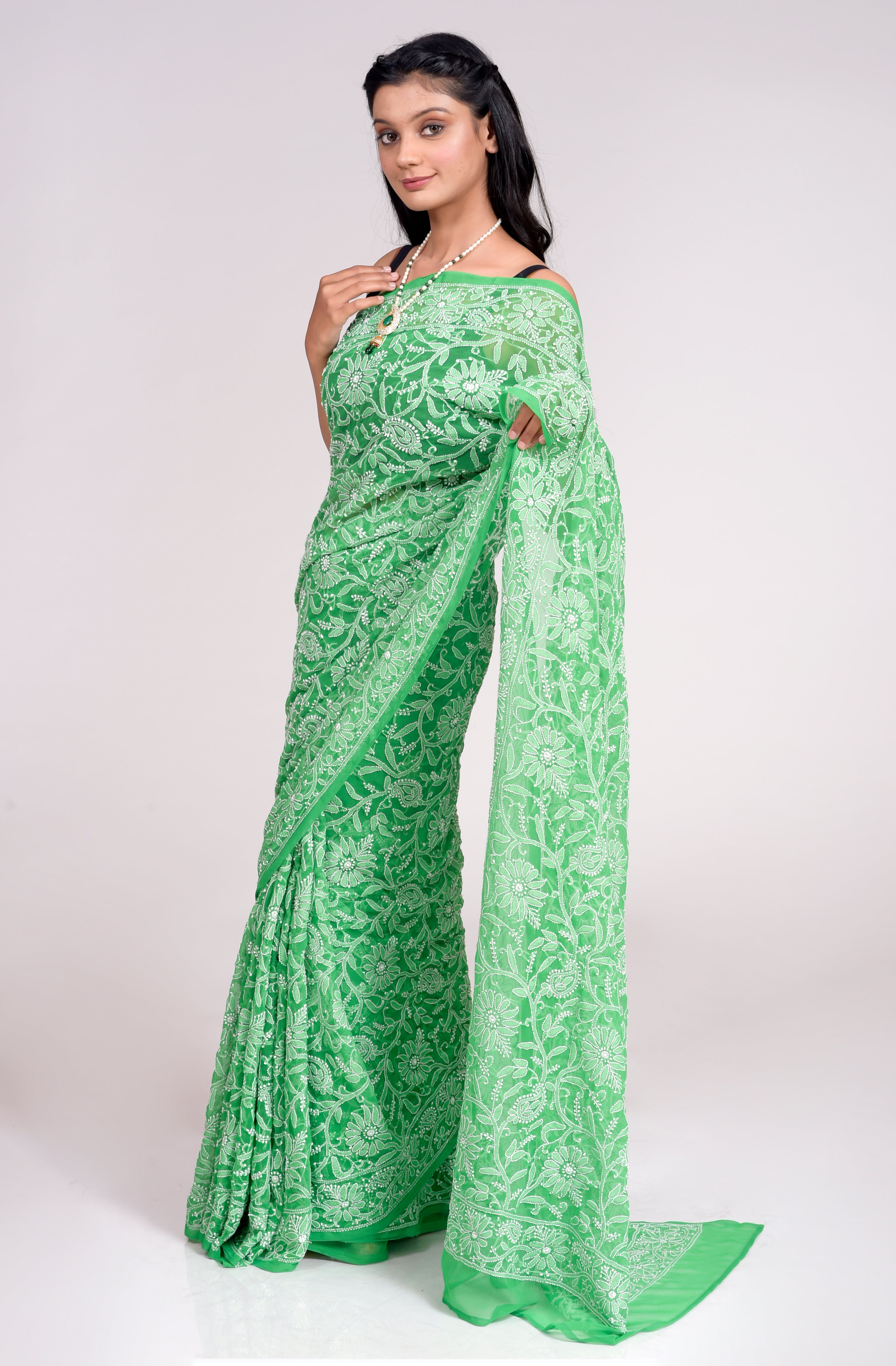 Lucknow Chikan Emporium Semi Georgette Green Colour Saree With Same Colour Blouse piece included. .