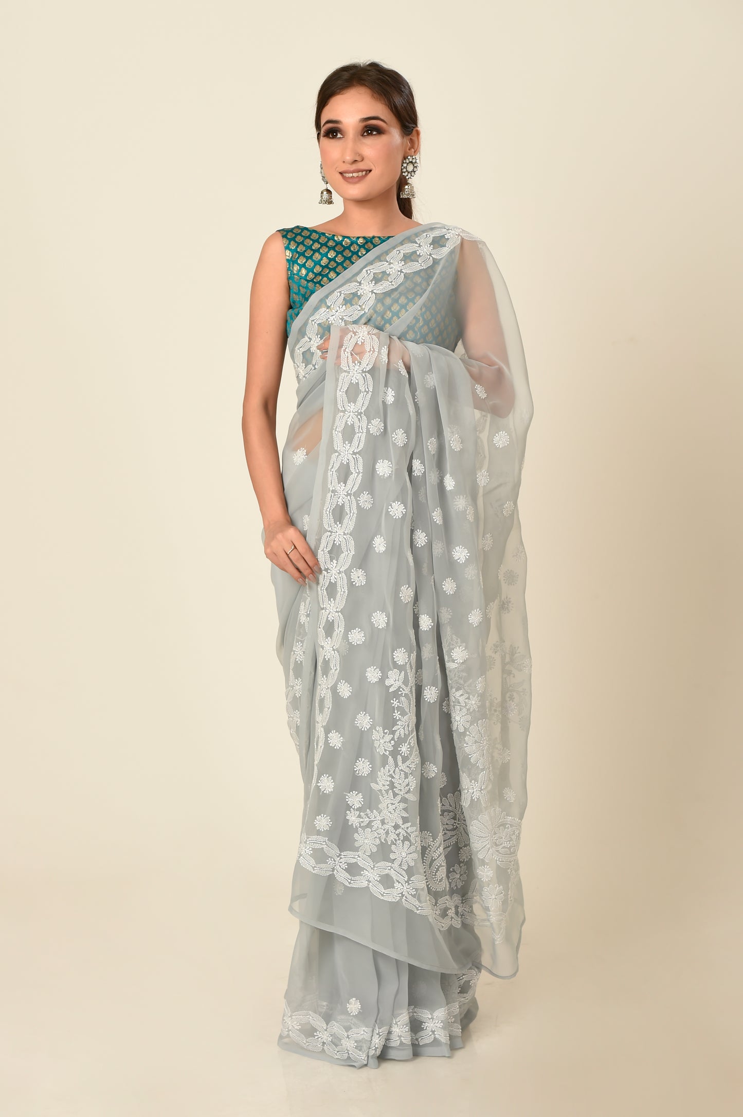 Lucknow Chikan Emporium skin friendly semi georgette grey colour with same colour blouse piece included.