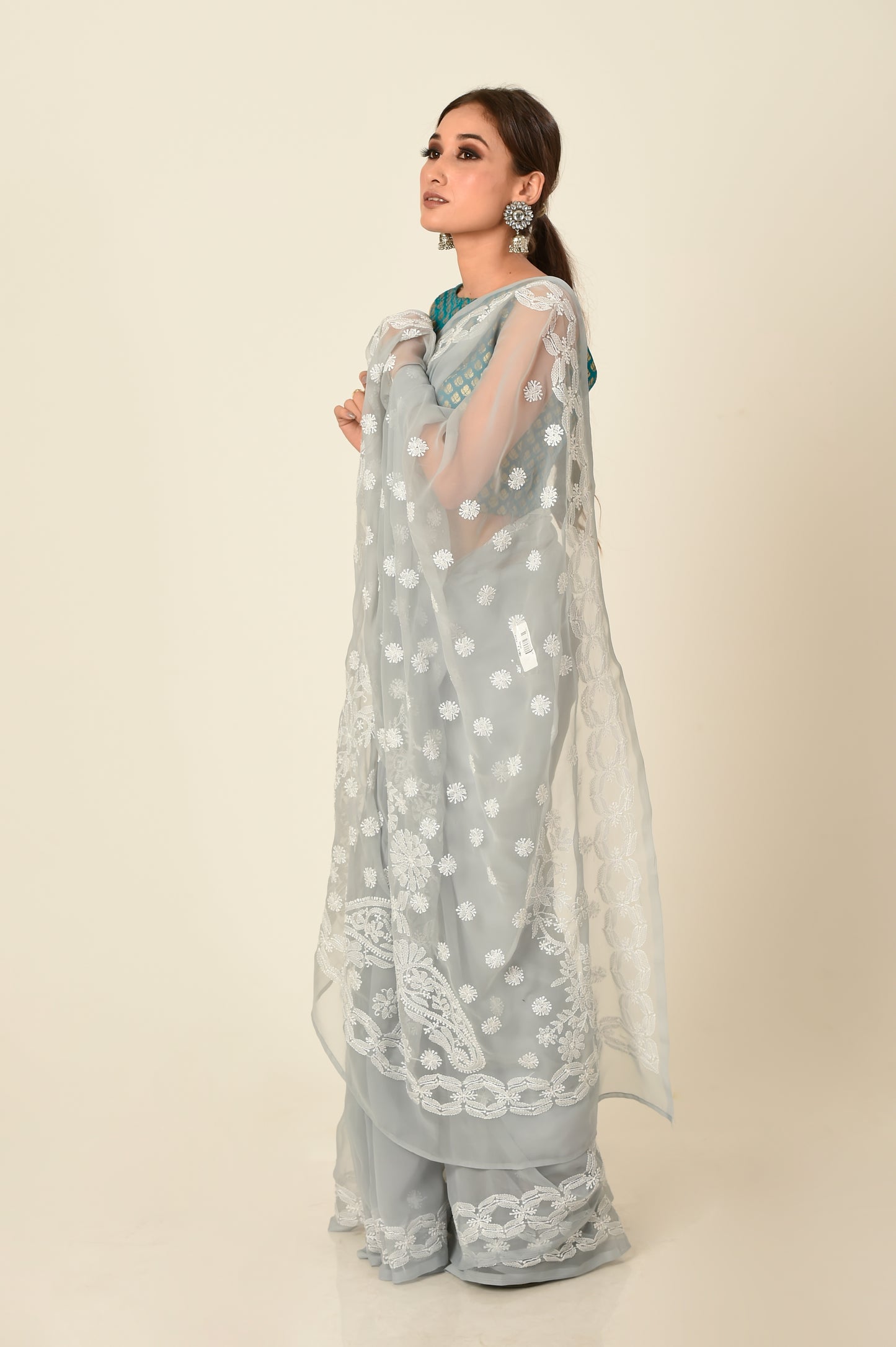 Lucknow Chikan Emporium skin friendly semi georgette grey colour with same colour blouse piece included.