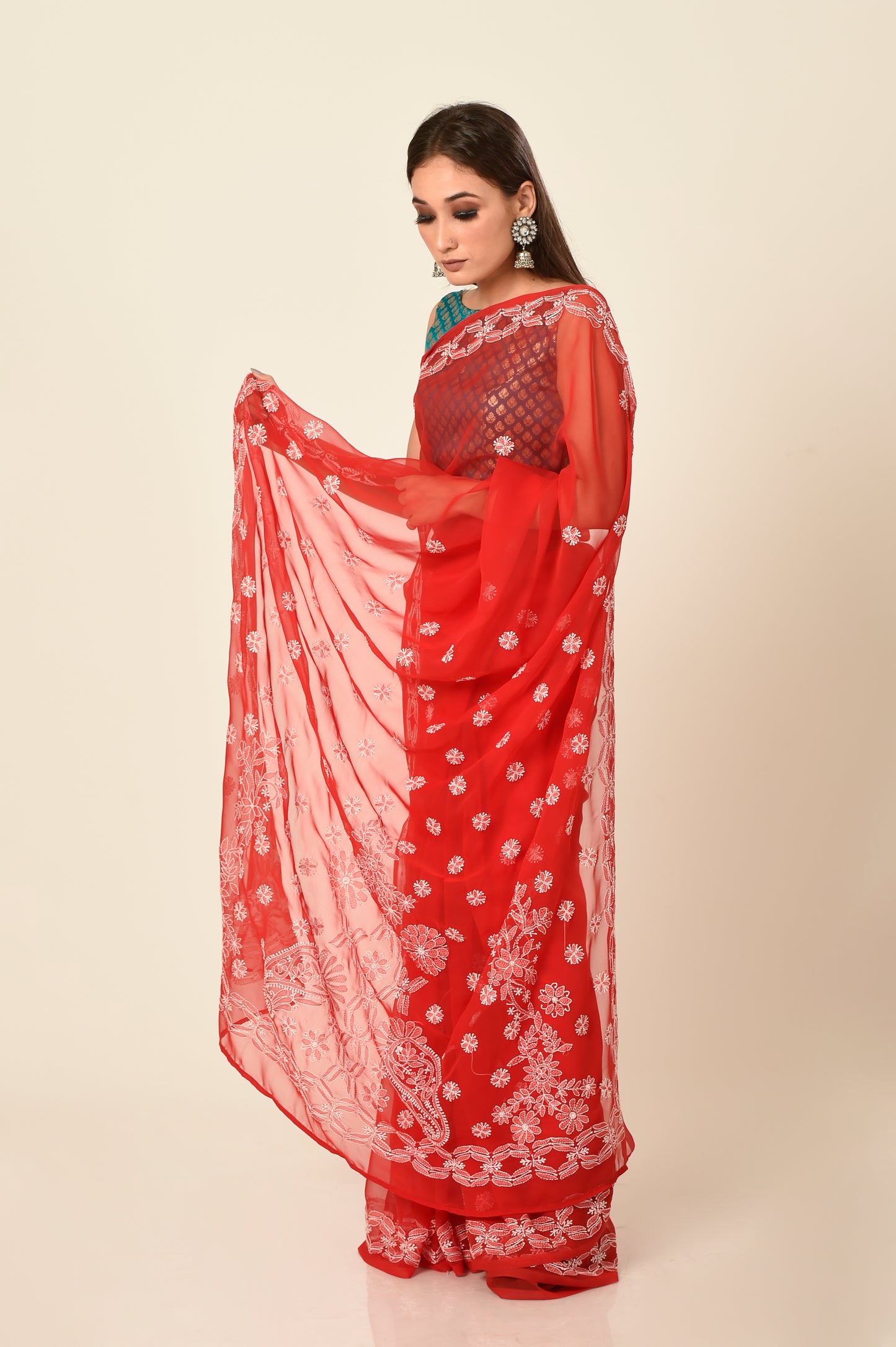 Lucknow Chikan Emporium skin friendly semi georgette red colour with same colour blouse piece included.