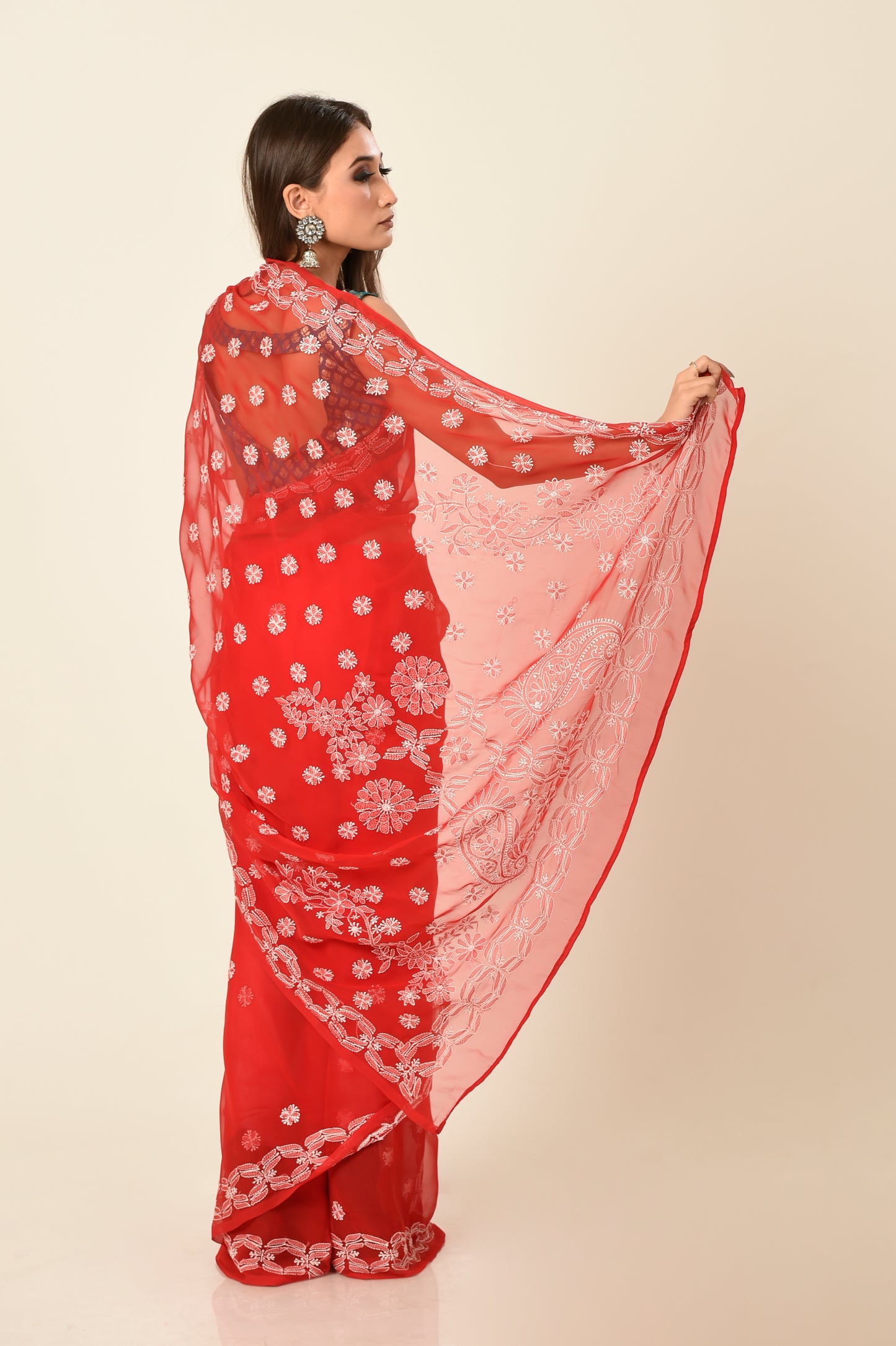 Lucknow Chikan Emporium skin friendly semi georgette red colour with same colour blouse piece included.