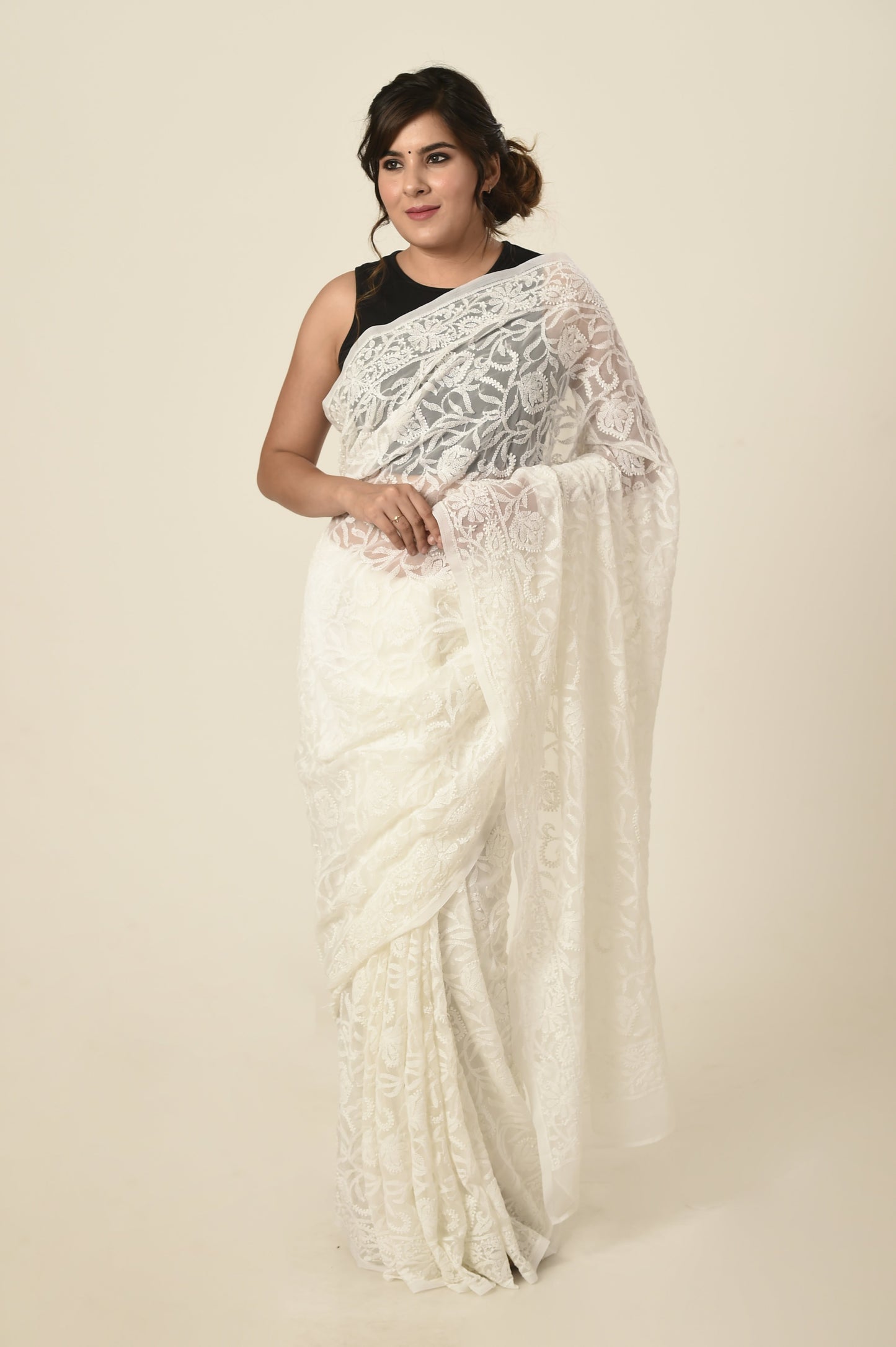 Lucknow Chikan Emporium semi georgette saree white colour with same colour blouse piece included.