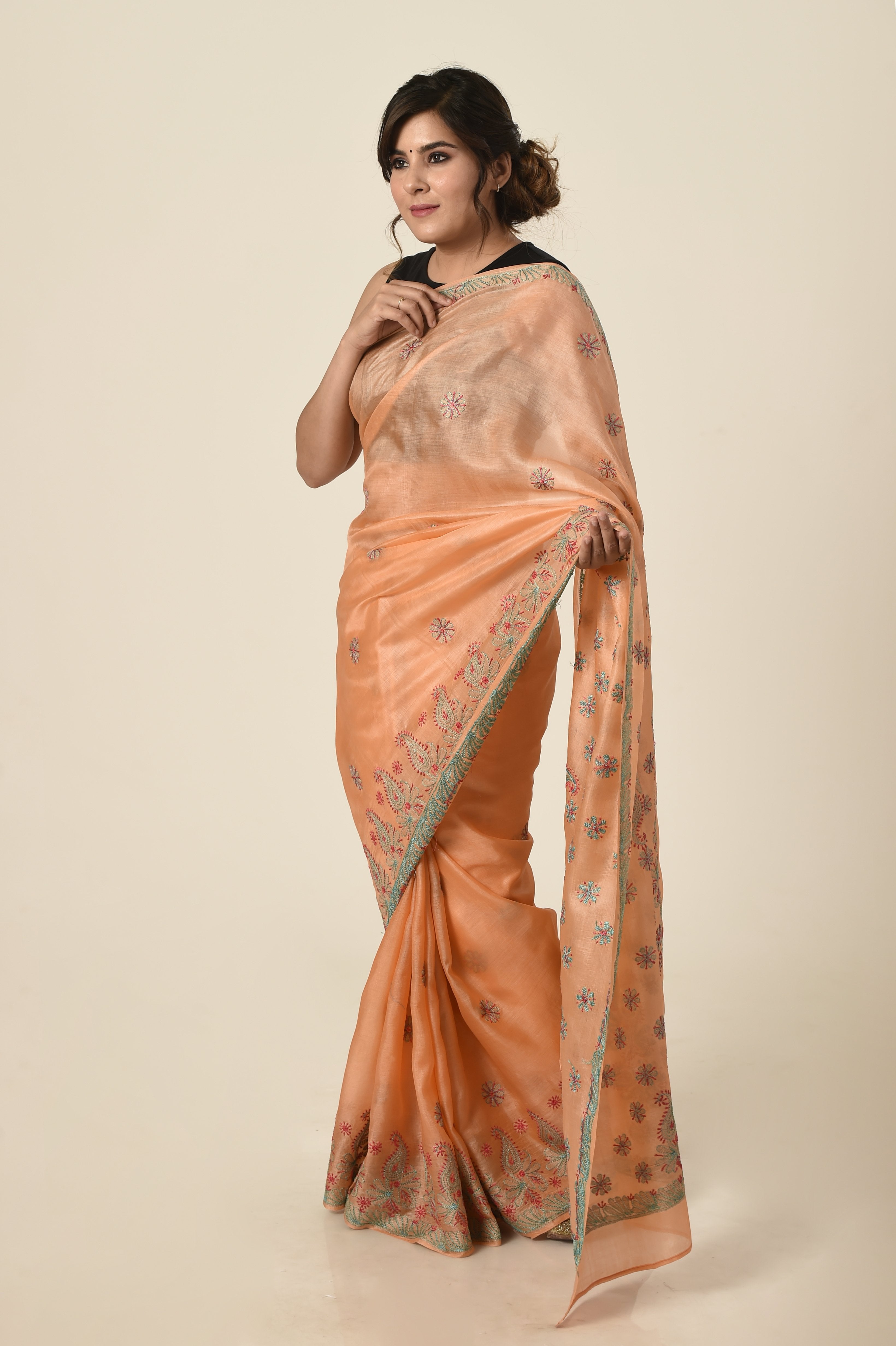 Lucknow Chikan Emporium tussar silk saree light peach colour with same colour blouse piece included.