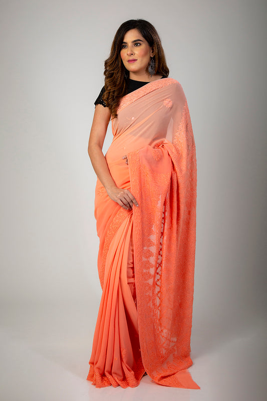 Lucknow Chikan Emporium Peach Shaded Pure Georgette Saree With same Colour Blouse piece included.