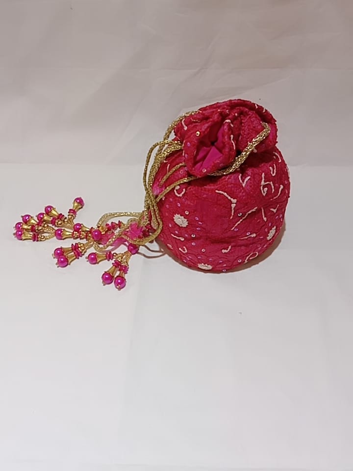 Nice Rani Pink Colour Fancy Silk Potlis With Hand chikankari Lucknow chikan Emporium.