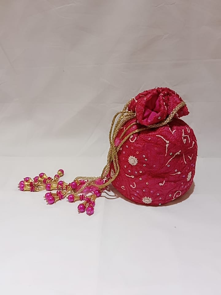 Nice Rani Pink Colour Fancy Silk Potlis With Hand chikankari Lucknow chikan Emporium.