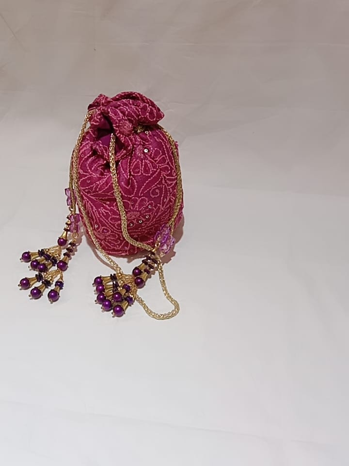 Nice Purple Colour Fancy Silk Potlis With Hand chikankari Lucknow chikan Emporium.